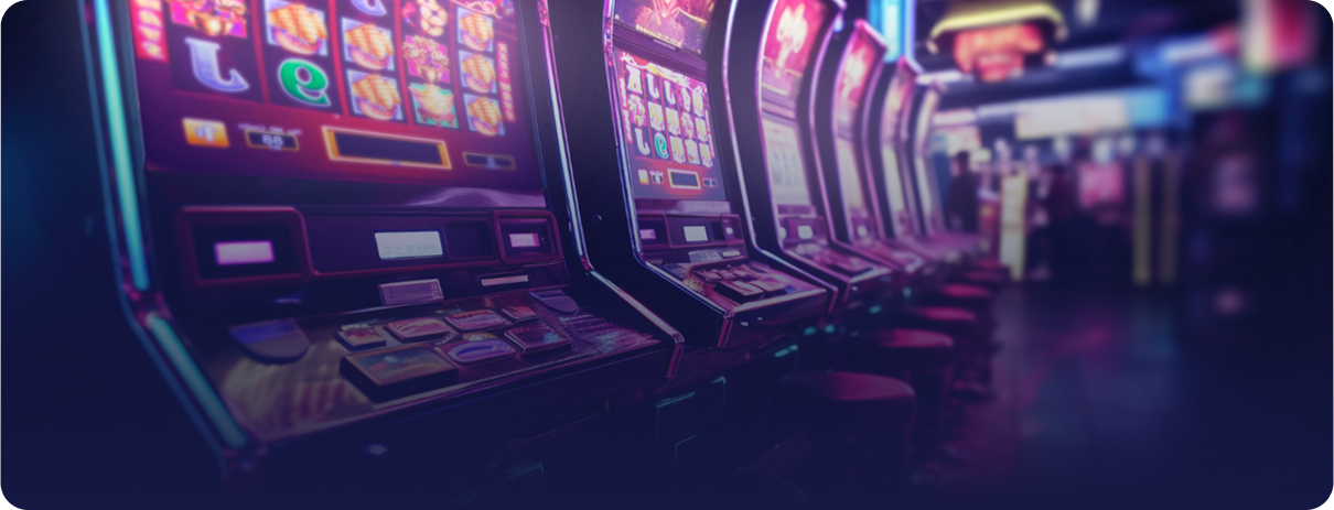 A row of brightly lit Multicasino slot machines glowing in a casino setting